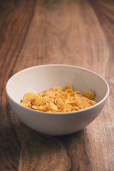 corn flakes in white bowl on table
