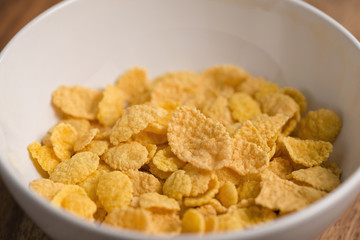 corn flakes in white bowl closeup
