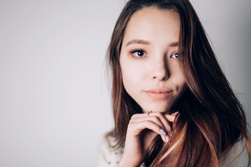 Fototapeta premium Close up portrait of beautiful young woman on white background. Horizontal, copyspace. Youth and Skin Care