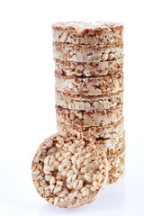 Round wheat crispbread, white background. Composition of crispbread on white background.