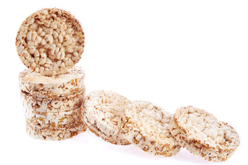 Round wheat crispbread, white background. Composition of crispbread on white background.