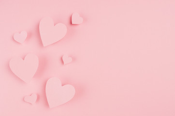 Paper hearts soar on pink background, copy space. Valentine.