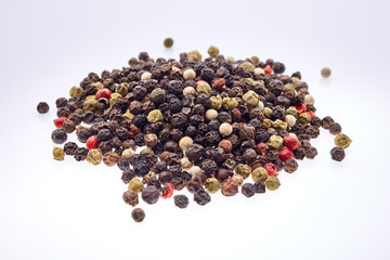 Seasoning - four kinds of pepper peas - isolated on white background