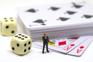 Businessman figure and table game accessories. Poker with dice. Poker hand.