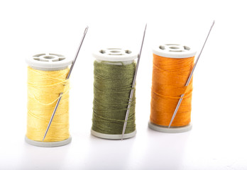 Colored sewing thread white background