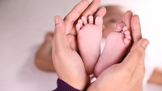 Tiny feet of newborn baby