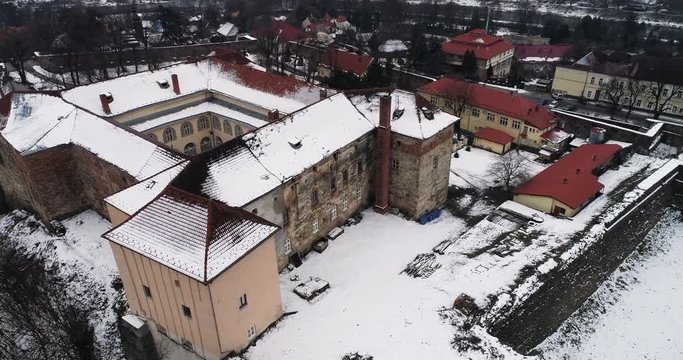 aerial beatiful grimly view on Uzhhorod Castle in winter.