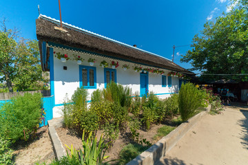 Fototapeta na wymiar Letea, Danube Delta, Romania, August 2017: Old Traditional House in Letea Village, Danube Delta, Romania