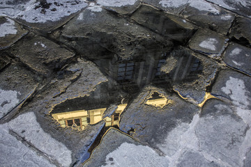 Uffizi gallery reflected in a puddle 