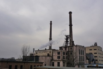 Industrial area with pipes and chimney with smoke in Beijing China