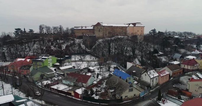 aerial beatiful grimly view on Uzhhorod Castle in winter.