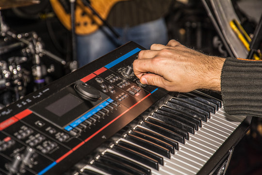 close-up photo of keyboards player
