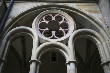 Detail of stone decorative Gothic window in gallery of catholic church in Trier, Germany.