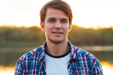 Portrait Of Young Handsome Man Smiling Outdoor