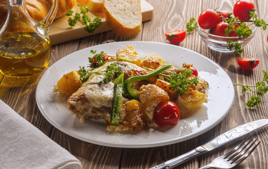 Chicken with potatoes, baked in the oven.