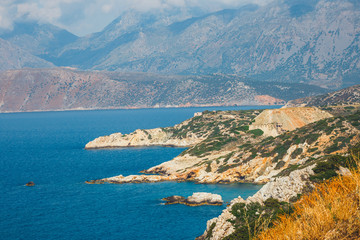 Fototapeta na wymiar Rocky coast near Agios Nikolaos on Crete, Greece