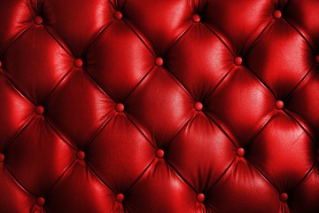 Saturated glossy red leather texture of sofa chair