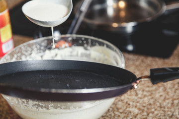 liquid dough is poured onto frying pan