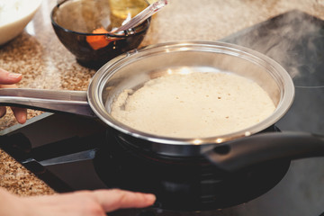 White pancake fry on white frying pan