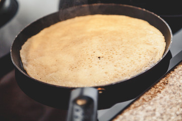 Yellow pancake fry in pan