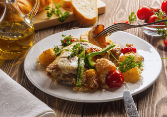 Chicken with potatoes, baked in the oven.