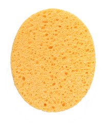 Oval yellow sponge vertical cleansing puff for face or cleaning surface texture isolated on white background on top view