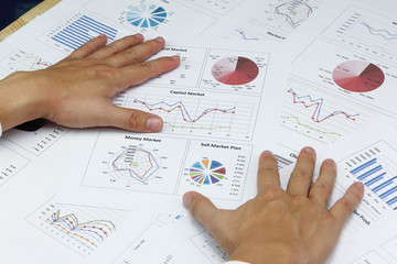 Businessman Summary report and capital market plan analyzing money market plan