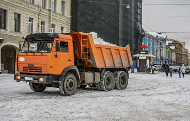 Snow removal on the town square in Saint-Petersburg.  Snow removal equipment.
