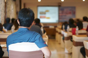 people or businessman training knowledge seminar and business meeting conference or education academic on warm white with projector screen in class room at convention hall