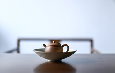 Dark-red enameled pottery teapot