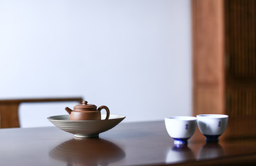 Dark-red enameled pottery teapot