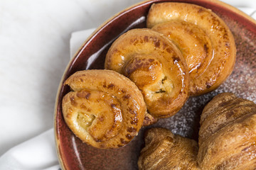 freshly baked buns with almonds. Croissants