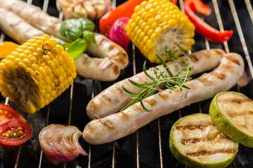 Preparing grilled sausage and vegetables