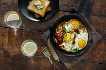 Fried eggs with bacon. Breakfast table concept