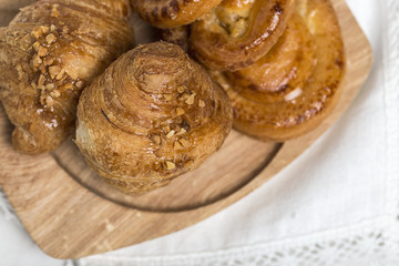 freshly baked buns with almonds. Croissants