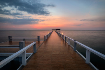 Fototapeta na wymiar bridge with sunset, background for travel, sea, beach and resort concept.