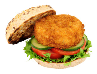Breadcrumb covered fish cake and salad sandwich isolated on a white background