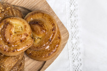 freshly baked buns with almonds. Croissants