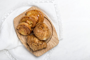 freshly baked buns with almonds. Croissants