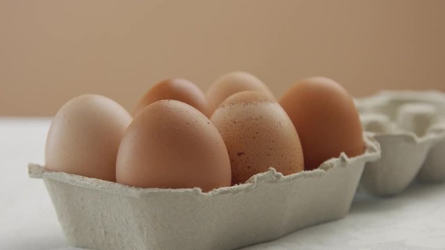 zoom to the box with brown eggs in studio
