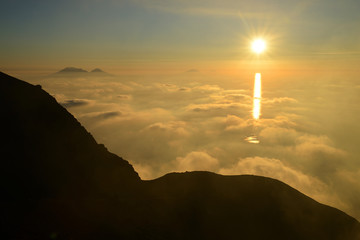 Spectacular sunset over the Aeolian Islands seen from the summit of Volcano Stromboli, Sicily, Italy