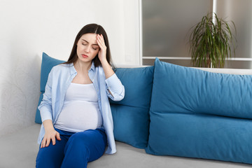 pregnant woman with a headache