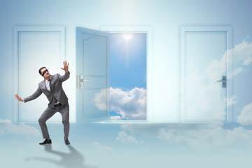Fototapeta premium Confused businessman in front of doors