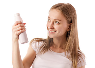 Beautiful young woman in the hands of bottle yogurt