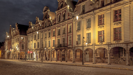 Facades of the houses of the two main squares of Arras in the Pas de Calais taken the night - obrazy, fototapety, plakaty
