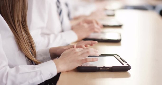 4k, Teenage school children with digital tablets in classroom