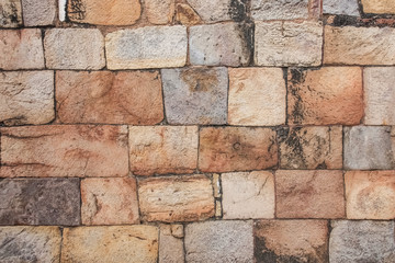 Colorful natural stone wall texture background.