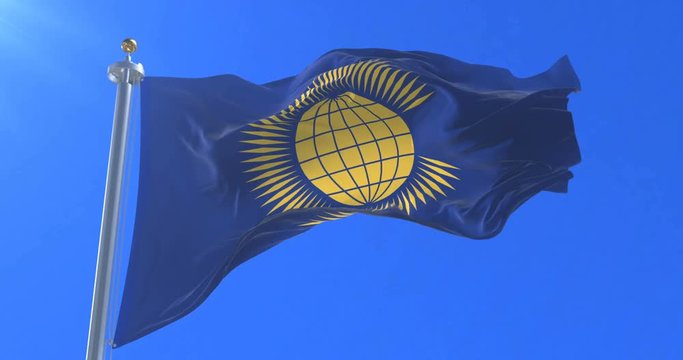 Flag of the Commonwealth Of Nations waving at wind with blue sky, loop