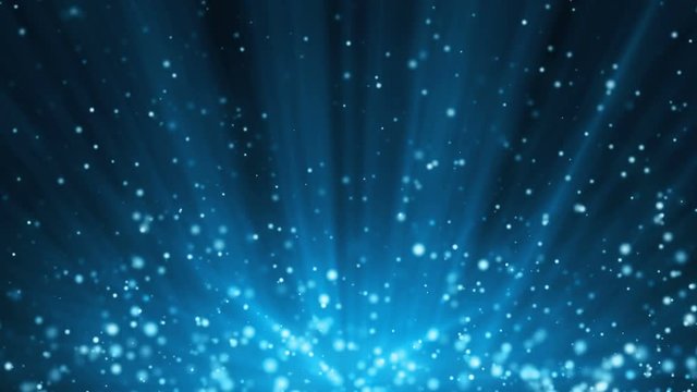 Seamless blue festive background with light rays and particles
