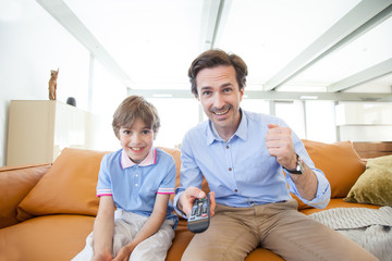 Father and son watching tv